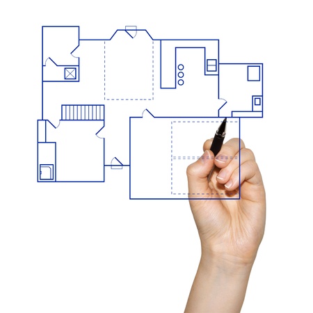 hand drafting a blueprint for a house