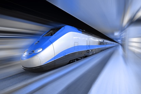 Fast train traveling at high speed through a stationのeditorial素材