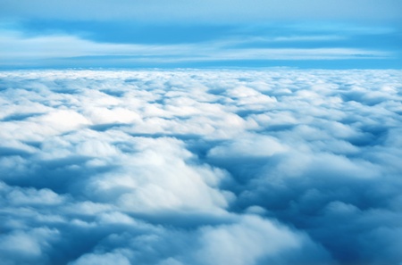 High above a sea of soft fluffy clouds
