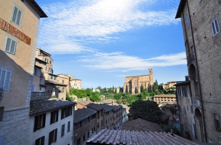 View of Siena from the rooftops with the Basilica of San Domenico in the backgroundの写真素材