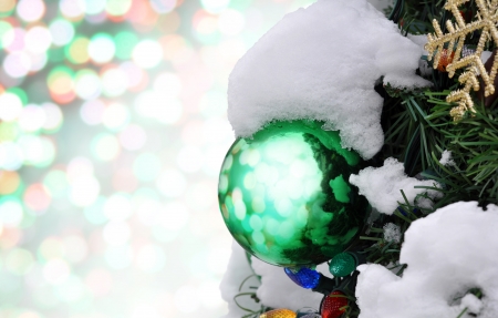 Decorations and snow on a Christmas treeの写真素材