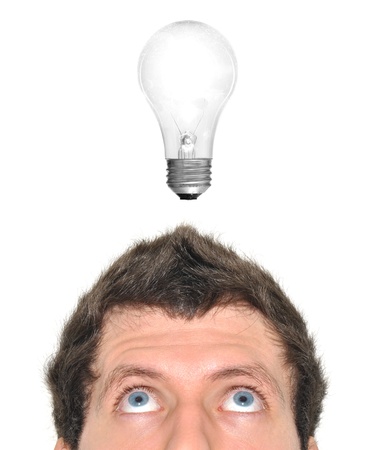 Lightbulb turning on over a man s headの写真素材