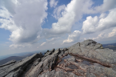 White clouds sweeping over a high mountain peak at Grandfather Mountain.の写真素材