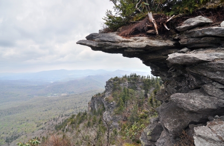 Horizontal cliff shelf jutting out from the mountainside with the Appalachian range in the background.の写真素材