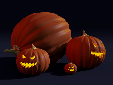 A big pumpkin and jack-o\'-lanterns carved for Halloweenの写真素材