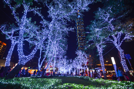 TAIPEI, TAIWAN - DECEMBER 23, 2016 - Christmas lights welcome people in the Xinyi Anhe area of Taipei, with the 101 building in the backgroundのeditorial素材