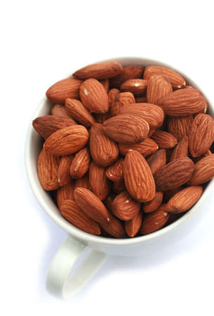 Almonds in Cup with white background の写真素材