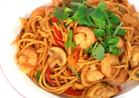 Stir fried Spaghetti isolated with white background の写真素材