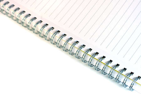 spiral lined notebook isolated on white の写真素材