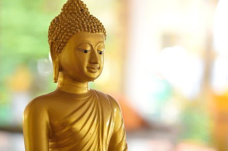 statue of buddha. Buddha statue on blurred background of asia. Concept of buddhist temples, tourism and worship.の写真素材