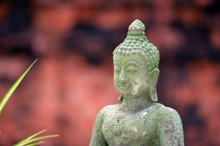 statue of buddha. Buddha statue on blurred background of asia. Concept of buddhist temples, tourism and worship.の写真素材