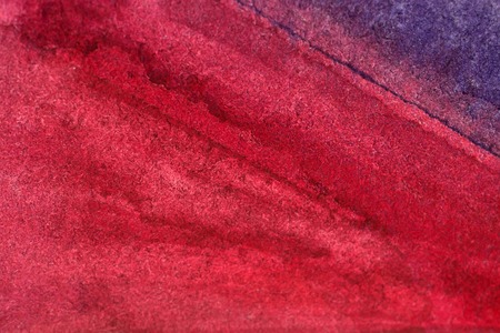 washy watercolor background in blue and redの写真素材