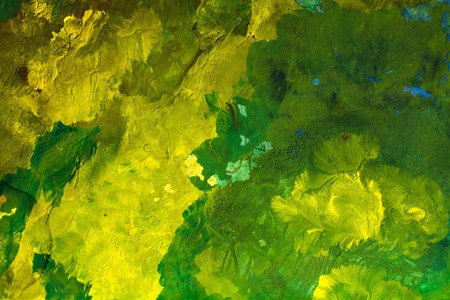 great green watercolor background - watercolor paints on a rough texture paperの写真素材