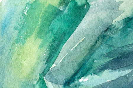 great green watercolor background - paints on a rough texture paperの写真素材