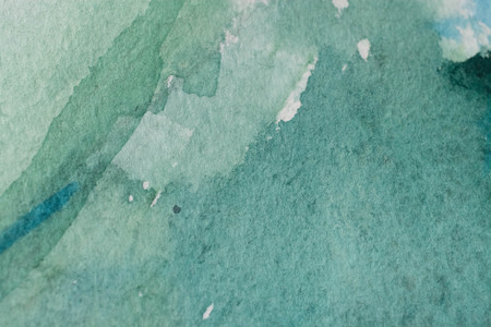 great green watercolor background - paints on a rough texture paperの写真素材
