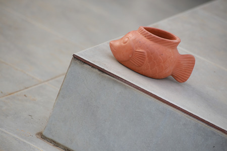 sculpture of fish is on one step of the stair の写真素材