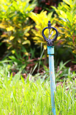 The sprinkler in grassland.Not in use now.の写真素材