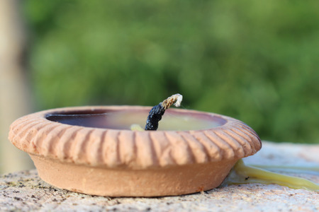 Used lantern plate out of flame and wax after Loy Kratong festival.の写真素材