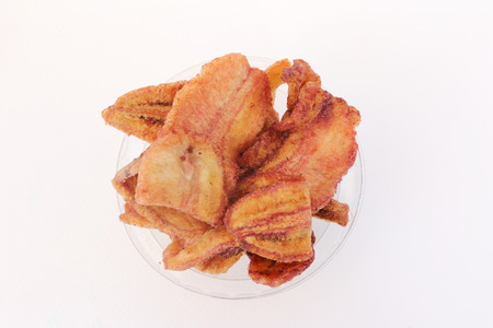 cup of fried banana on white background.の写真素材