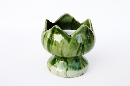 green ceramic candlestick on white backgroundの写真素材