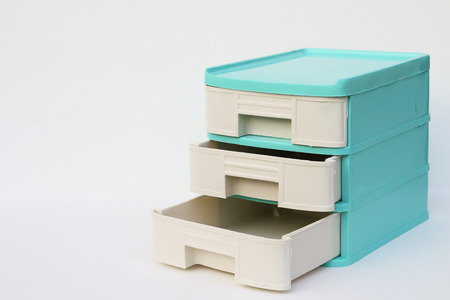green plastic drawer which have three drawer on white backgroundの写真素材
