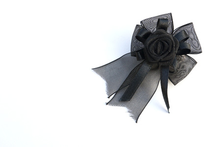 fancy flower black ribbon on white backgroundの写真素材
