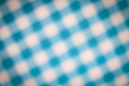 blur background from blue chessboard fabric with vignetteの写真素材