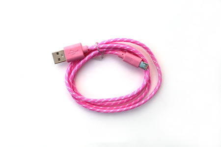 image of pink wire usb on whte background