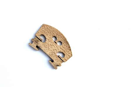 old bridge of violin on white backgroundの写真素材