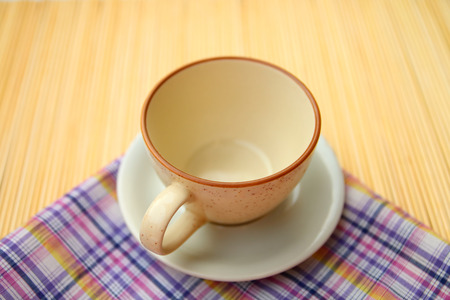 blur image of empty coffee cup on linenの写真素材