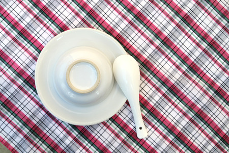 white table set on linen in soft focusの写真素材
