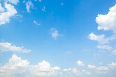 The vast blue sky and clouds sky background. White fluffy clouds in the blue sky.の写真素材