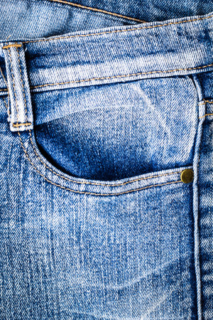 Denim jeans texture background. Close up of blue jeans with pocket.の写真素材