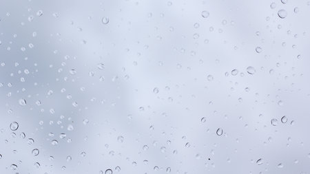 Water drops on window glass. Rain drops on window glass background.の写真素材