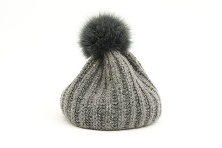 Cosy grey soft cap with bob on white backgroundの写真素材