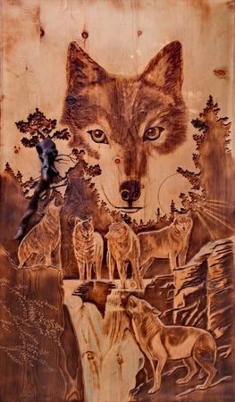 Mountain Altai. Russia. 05/08/2018. In the reserve's cordon Bele at the Teletskoe lake is open an amazing guest house for tourists, where many paintings and sculptures in wood by local craftsmenのeditorial素材