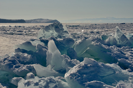 Russia. Eastern Siberia, lake Baikal. The icy cliffs of the island of Olkhon.