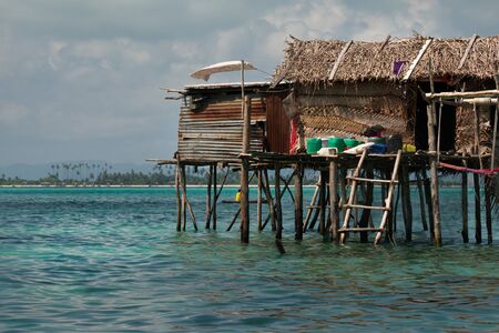 East Malaysia. island of Borneo. 2018/11/29. Sea Gypsies relax after a night of fishing in a fishing...