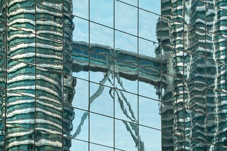 Malaysia. Mirror reflection of the capital of Kuala Lumpur, built of glass and concrete.の写真素材