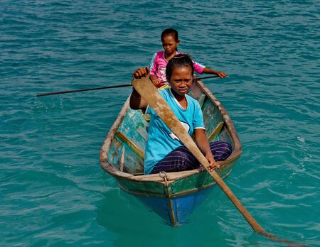 East Malaysia. island of Borneo. 2018/11/29. Young Gypsies from a fishing village on wooden boats...