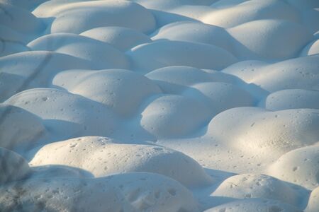 Russia. Mountain Altai. Texture relief of hummocks on a swamp covered with snow in late late autumn.の写真素材