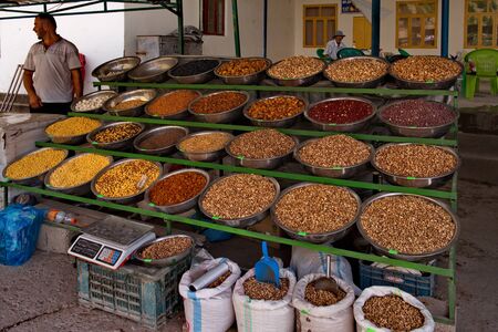 Tajikistan. 05/08/2019. The Central market in the city of Isfara. Locals sell a variety of fruits and spices grown on their land.のeditorial素材