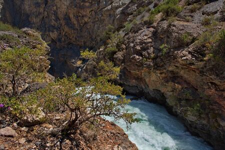 Tajikistan. The Pamir highway. Panorama of the mountain river Iskanderdarya flowing from lake...