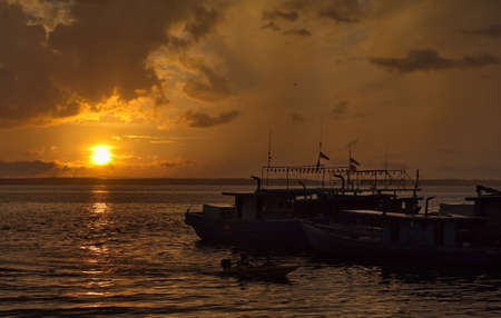 SANDAKAN. MALAYSIA. November 26, 2018. Small fishing vessels are moored at the pier of the fish market, waiting for the sale of fresh catch of sea fish.のeditorial素材