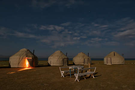 Kyrgyzstan. Moonlit camping on the shore of the high-altitude lake Son-Kul along the Eastern section of the Pamir highway.のeditorial素材