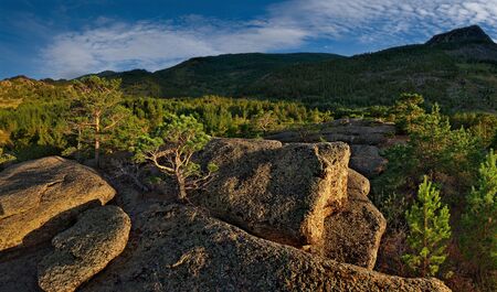 Eastern Kazakhstan. Picturesque sunset in the mountain natural Park Bayanaul, the age of the ancient remains of which is about 30 million years.の写真素材