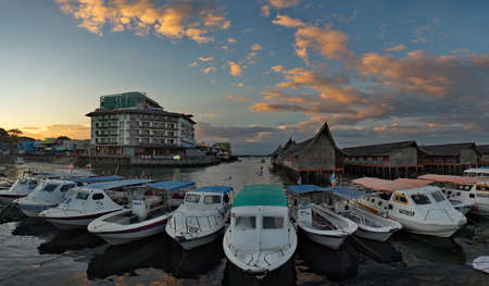 Sandakan. Malaysia November 27, 2018. Large fishing boats are moored at the fish market pier on the...