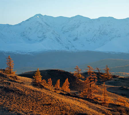 Russia. Gloomy sunset in the Altai mountains. Late autumn at the North-Chuya mountain range in the heart of the Kurai steppe.の写真素材