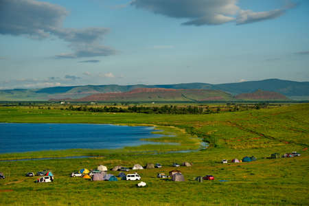 Russia. Republic Of Khakasia. Steppe salt dough of the lake, among the picturesque rolling mountains near the village of Shire.の写真素材