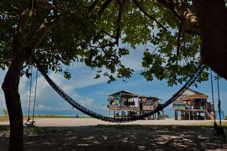 East Malaysia. Sea Gypsy village on a sandy coral reef island. The main trade of local residents is...